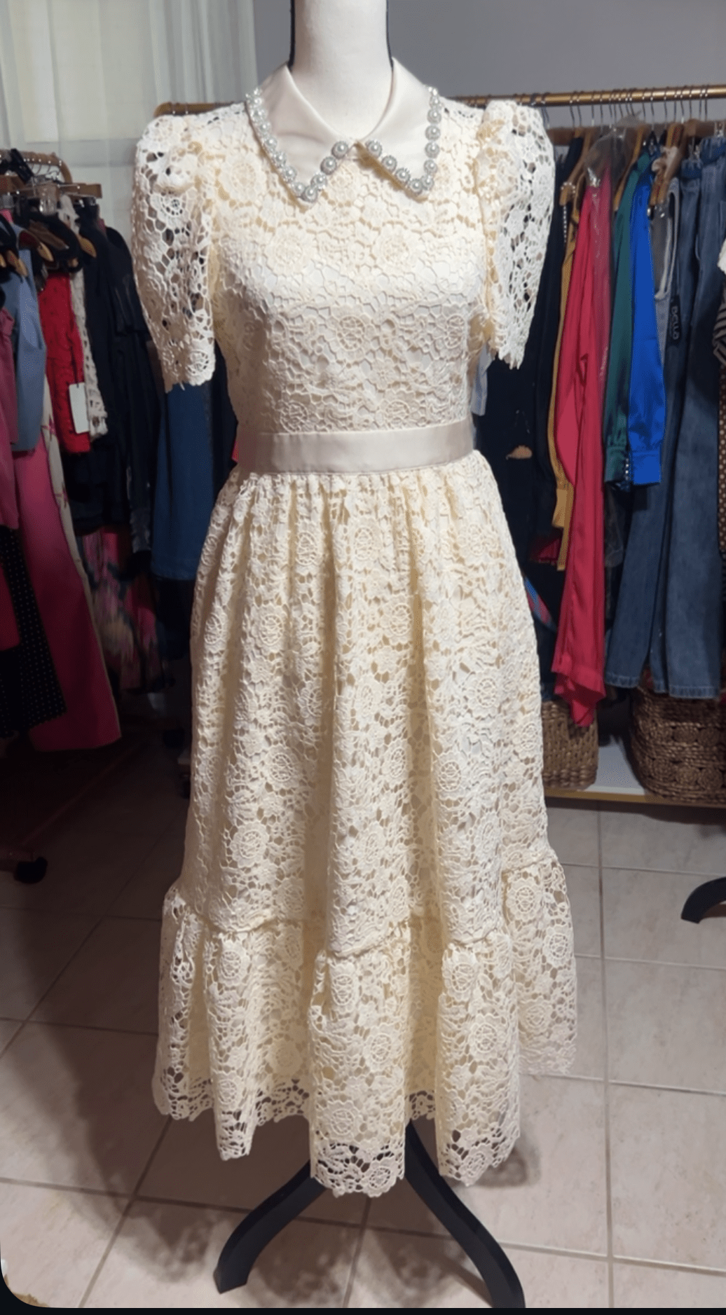 Ivory Lace Boho Chic Midi Dress with Vintage embellish collar displayed in boutique setting