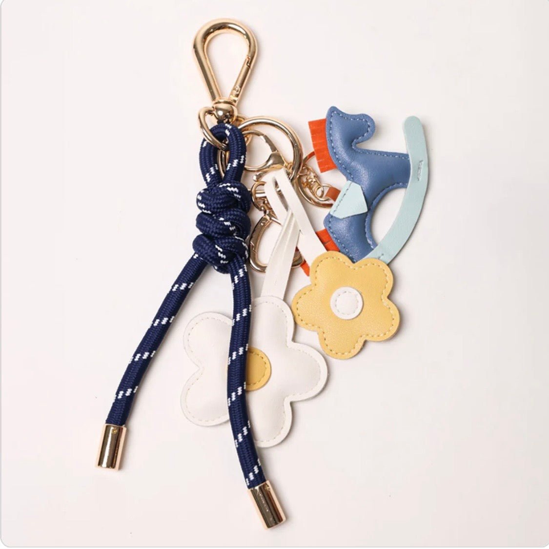 KEY CHAIN DEEP BLUE WITH CHARMS - YELLOW DAISIES AND BLUE ROCKING HORSE - Bella & Bellasbylola.com